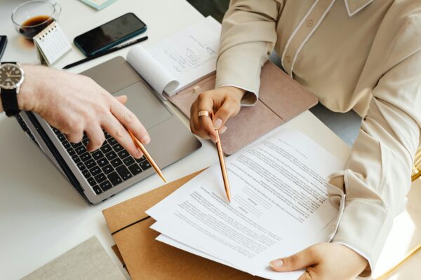 A lawyer reviewing documents from the Administrative Appeals Tribunal