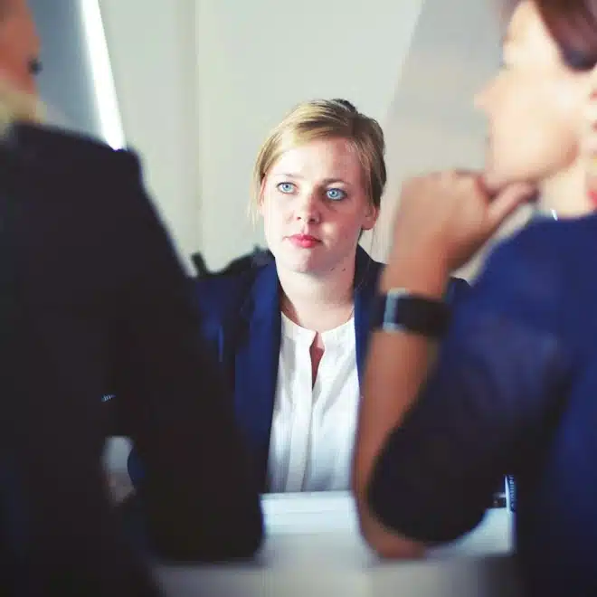 Australian work visa lawyer discussing skilled migration with two clients